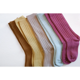 Five pairs of cute knee high socks in pastel colors for babies and kids