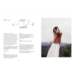 Cozy earth-toned knit sweater with textured knit patterns and ribbed cuffs