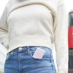 Pink compact wallet with soft texture and pocket hand sanitizer