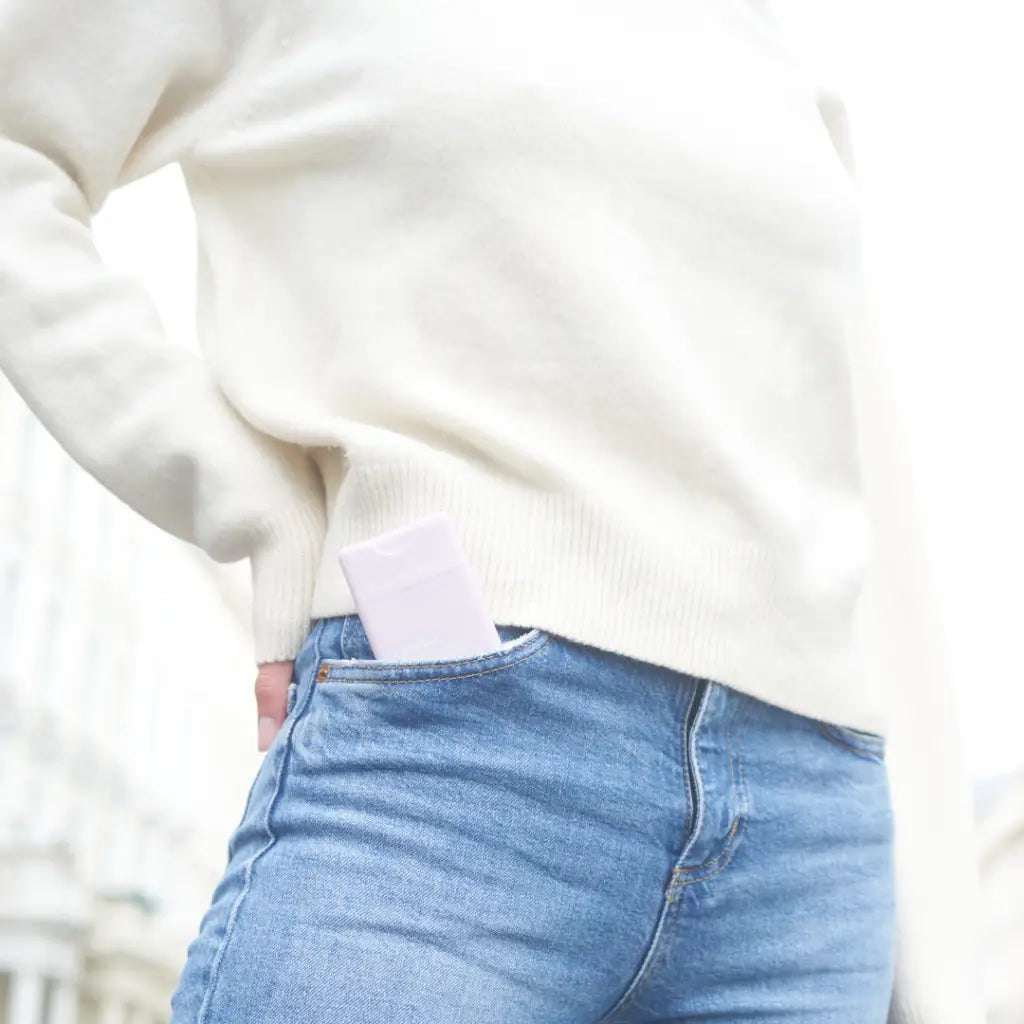 White pocket hand sanitizer in smooth rounded case