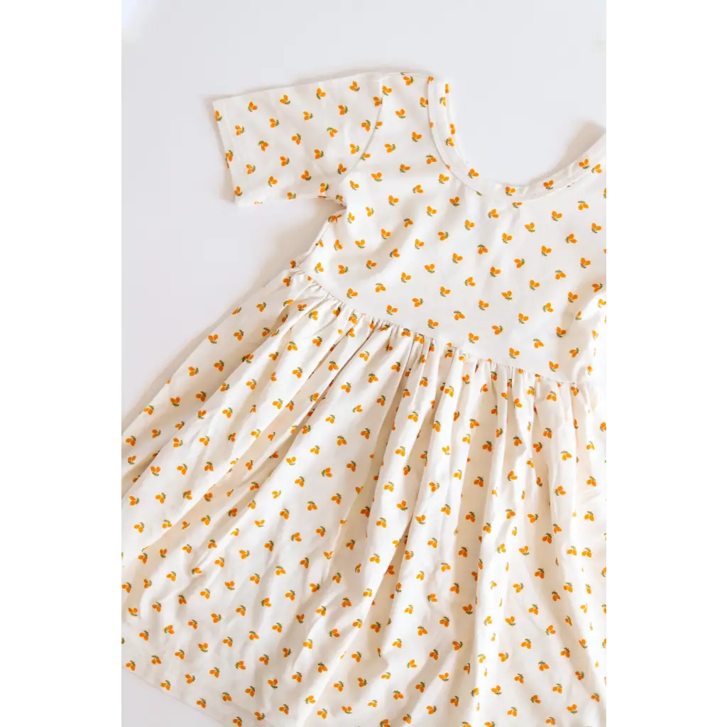 White Lemon Shake Up All Day Twirl Dress for Kids with tiny orange floral print