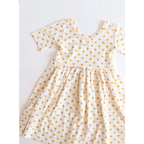 White day twirl dress with short sleeves and tiny orange hearts for kids