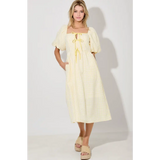 Woman in Lemon Meadow Gingham Midi Dress wearing a yellow gingham midi dress
