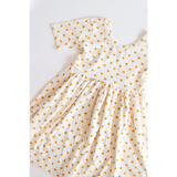 Lemon Shake Up Twirl Dress for Kids in white with tiny orange floral print pattern