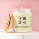 Lit candle in glass jar with Let That Shit Go label in Rose + Patchouli, creating small batches