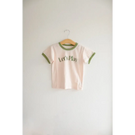 Kids Play Retro Ringer T-shirt with green trim and Let’s Play text on a hanger