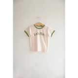 Kids Play Retro Ringer T-shirt with green trim and Let’s Play text on a hanger