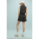 Black sleeveless romper with elastic waist in polished prints from Lexie Athletic Romper