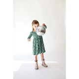 Green floral print Lily Flower Check Long Sleeved Twirl Dress paired with tan ankle boots