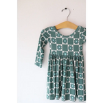 Green and white checkered long-sleeve dress on a hanger, perfect Lily Flower Check style