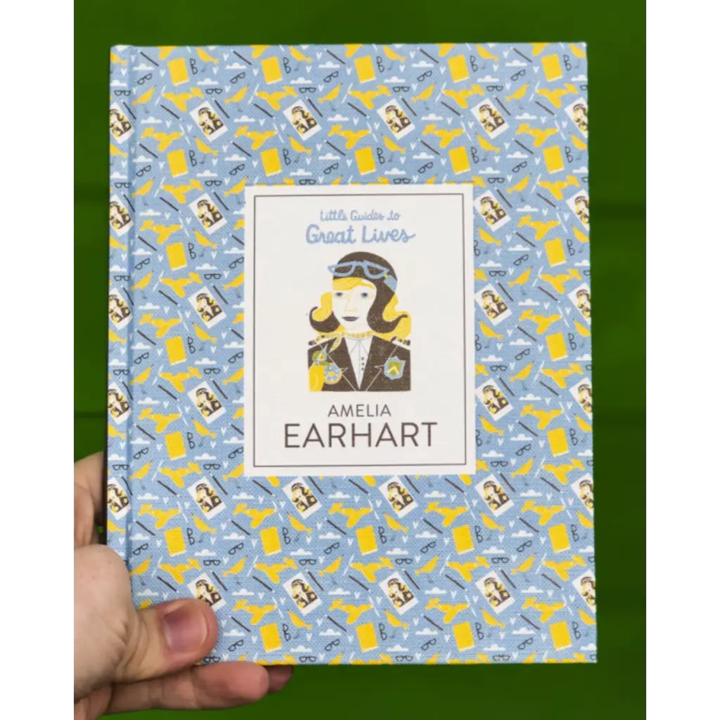 Colorfully illustrated book about Amelia Earhart’s life with fun aviation pattern cover