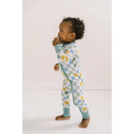 Adorable toddler in pastel checkered pajamas from Little Houses Bamboo Baby Sleeper