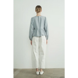 Back view of light blue peplum blouse with long sleeve denim bow and white pants outfit