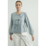 Light Blue Peplum Blouse featuring Sleeve Denim Bow details and puffed sleeves