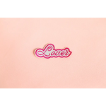 Pink and white cursive text of Lover on a fun iron-on patch for style upgrades