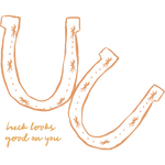 Orange horseshoe logo on comfort colors oversized unisex tee