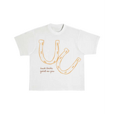 Luck Looks Good On You oversized unisex tee with orange horseshoe