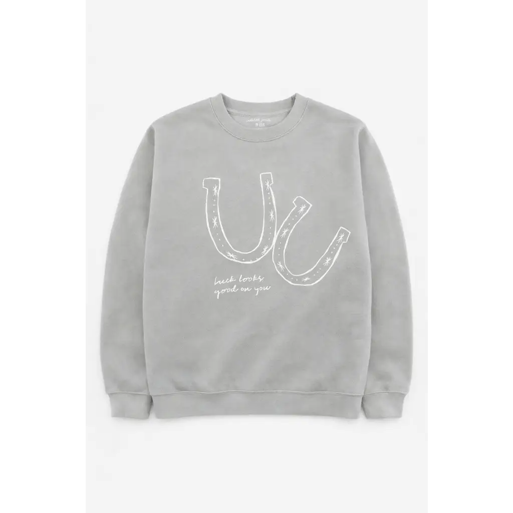 Gray sweatshirt with soft white horseshoe graphic and Luck looks good on you print