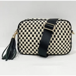 Black and white checkered woven camera bag with leather tassel detail