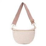 Pink checkered Lucy Woven Sling Bag made from vegan leather with an adjustable wide strap