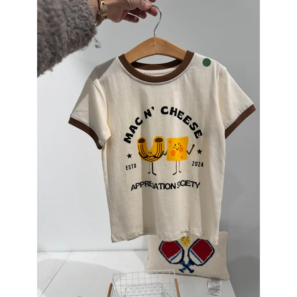 Cream-colored Mac n Cheese Appreciation Ringer with cute graphics, perfect stylish womens clothes