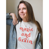 Woman wearing a magic and brain t-shirt featuring Kate Baer’s moon song design, final sale