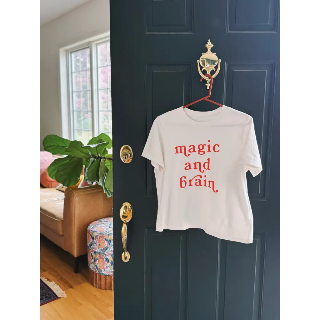 White t-shirt with red lettering featuring moon song and kate baer’s design, final sale