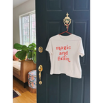 White t-shirt with red lettering featuring moon song and kate baer’s design, final sale