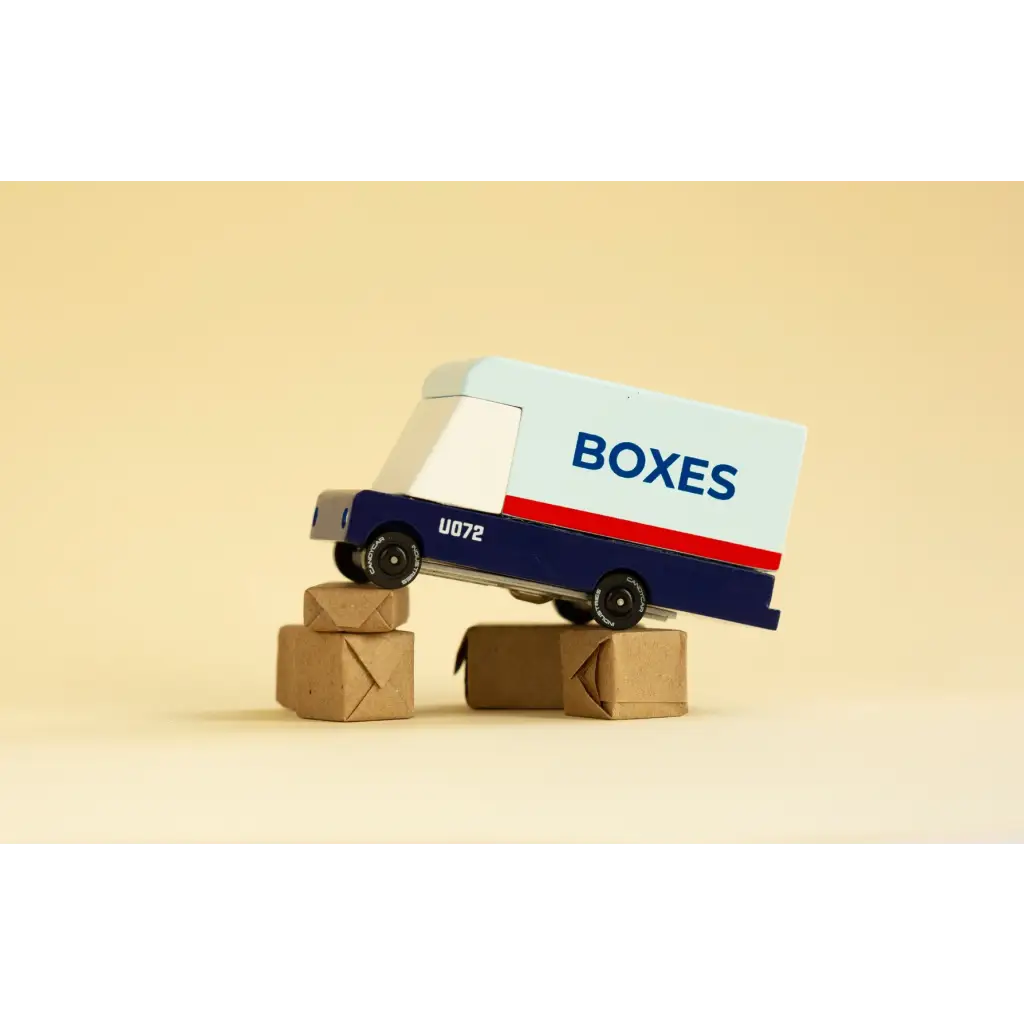 Toy mail van delivering boxes for fun with blue and white design