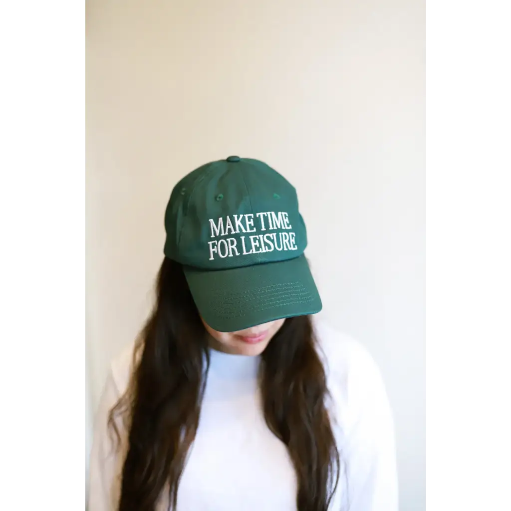 Green embroidered baseball hat with Make Time for Leisure text perfect for casual vibes