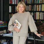 Martha Stewart gardening handbook in beige ribbed knit sweater with puffed sleeves