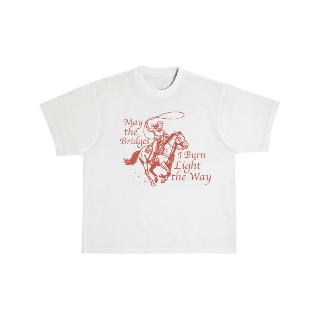 Oversized unisex tee with red cowboy graphic and May the Bridges I Burn Light the Way text