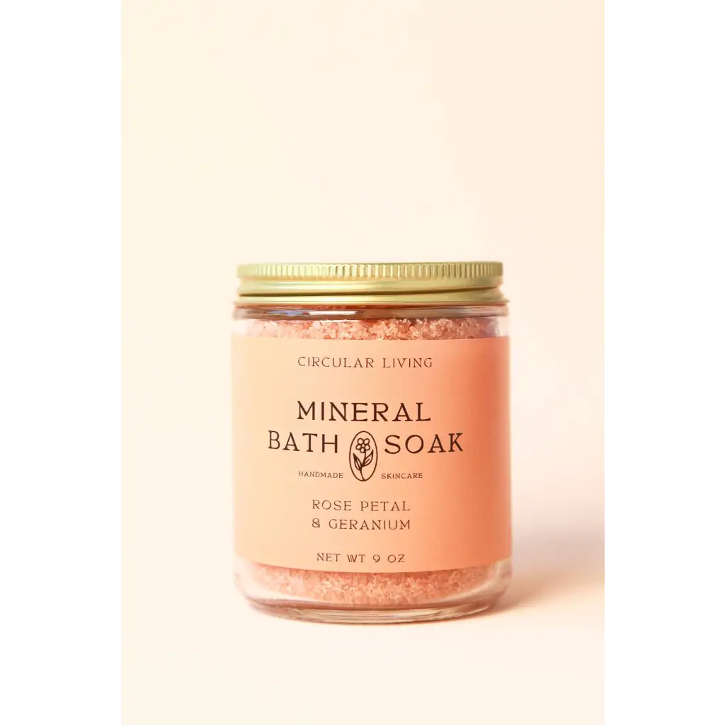 Pinkish-orange rose petal mineral bath soak jar with geranium scent
