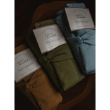 Three Mini Cozy Organic Cotton Blanket Bundles in brown, olive, and light blue