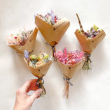Mini dried flower bouquets in pastel hues, hand-tied with twine