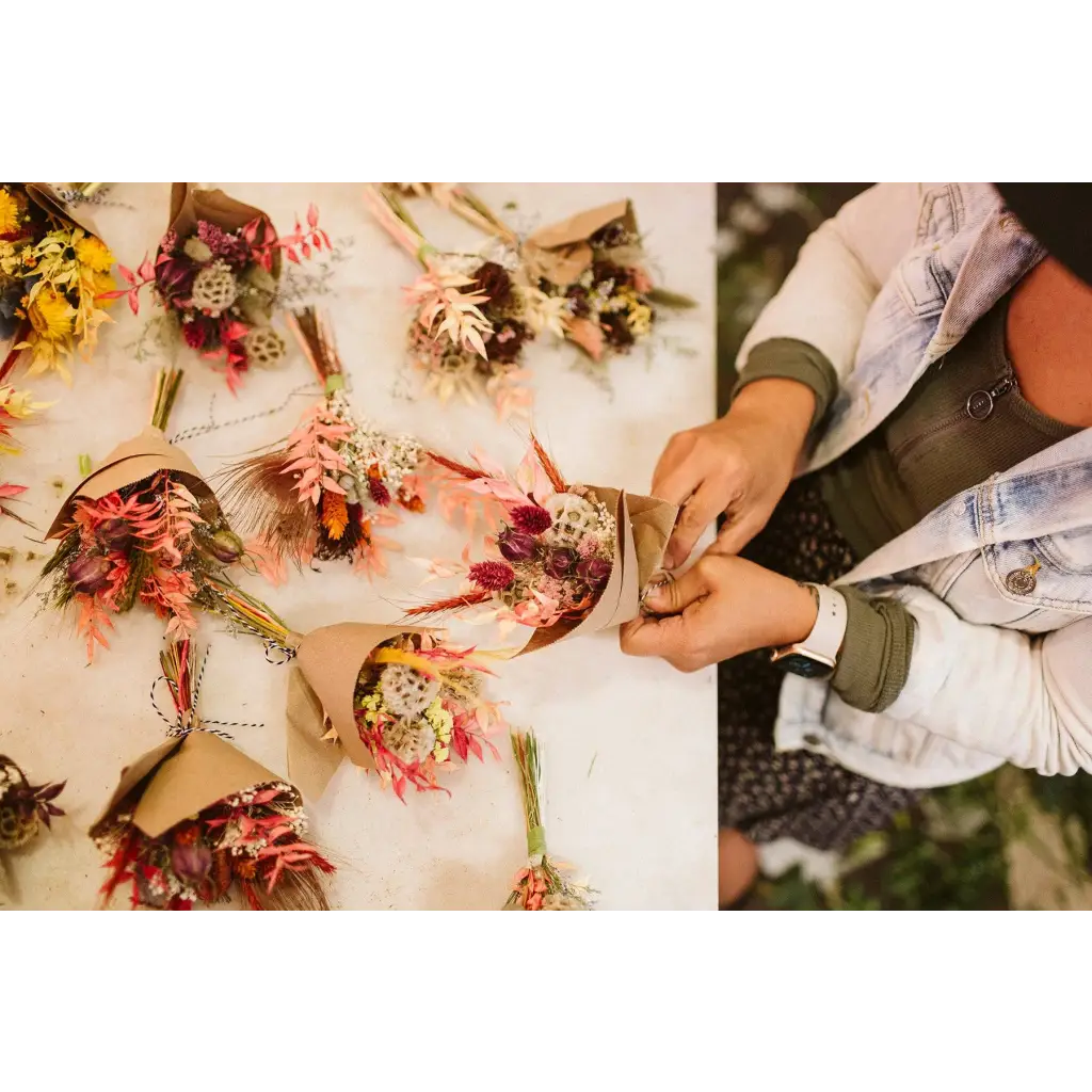 Mini dried flower bouquets in vibrant reds, pinks, yellows
