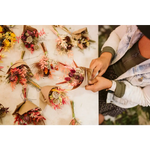 Mini dried flower bouquets in vibrant reds, pinks, yellows