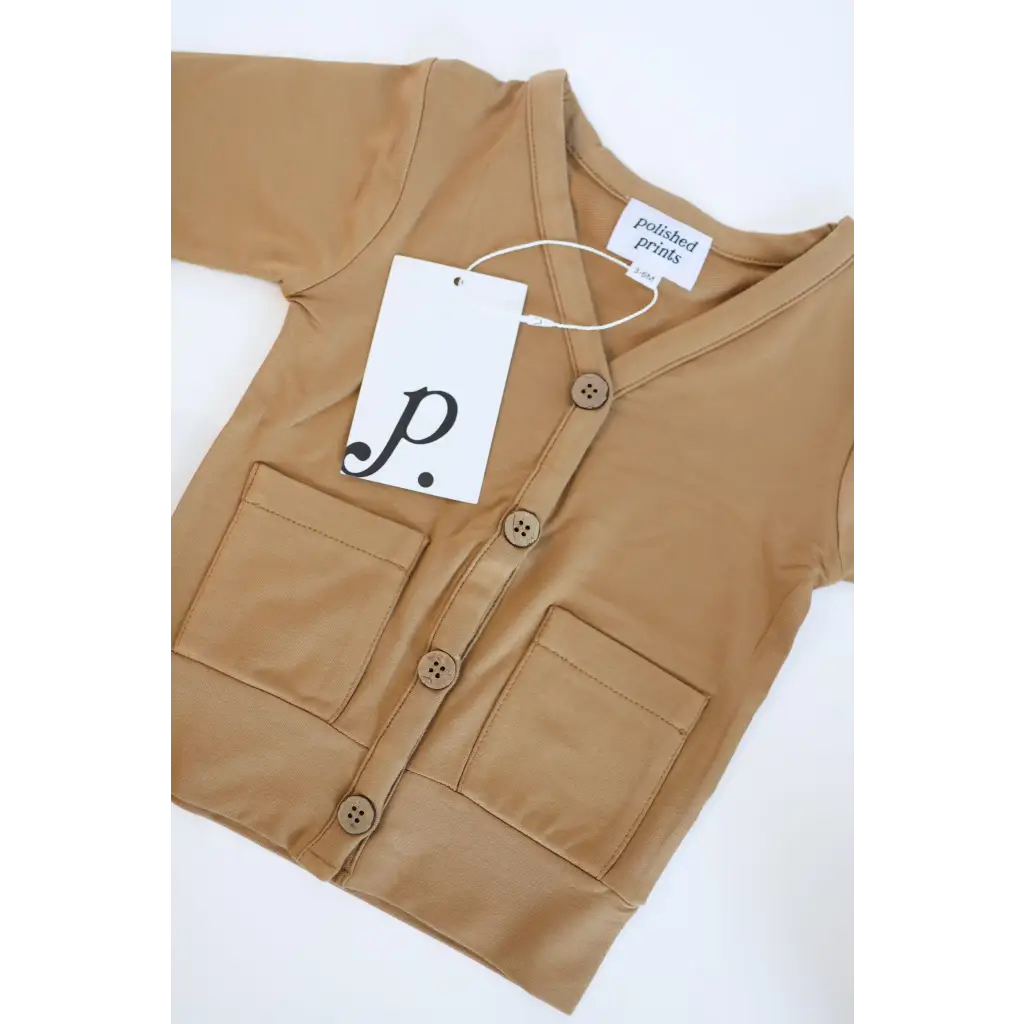 Tan button-up vest with pockets and a price tag for the Buttery Soft Mini Grandpa Cardigan