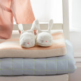Cute Mint Bunny Baby Booties: white rabbit slippers with pink hearts on peach cushion
