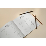 Open notebook with drawings and pencils for 5-minute beginner-friendly drawing lessons