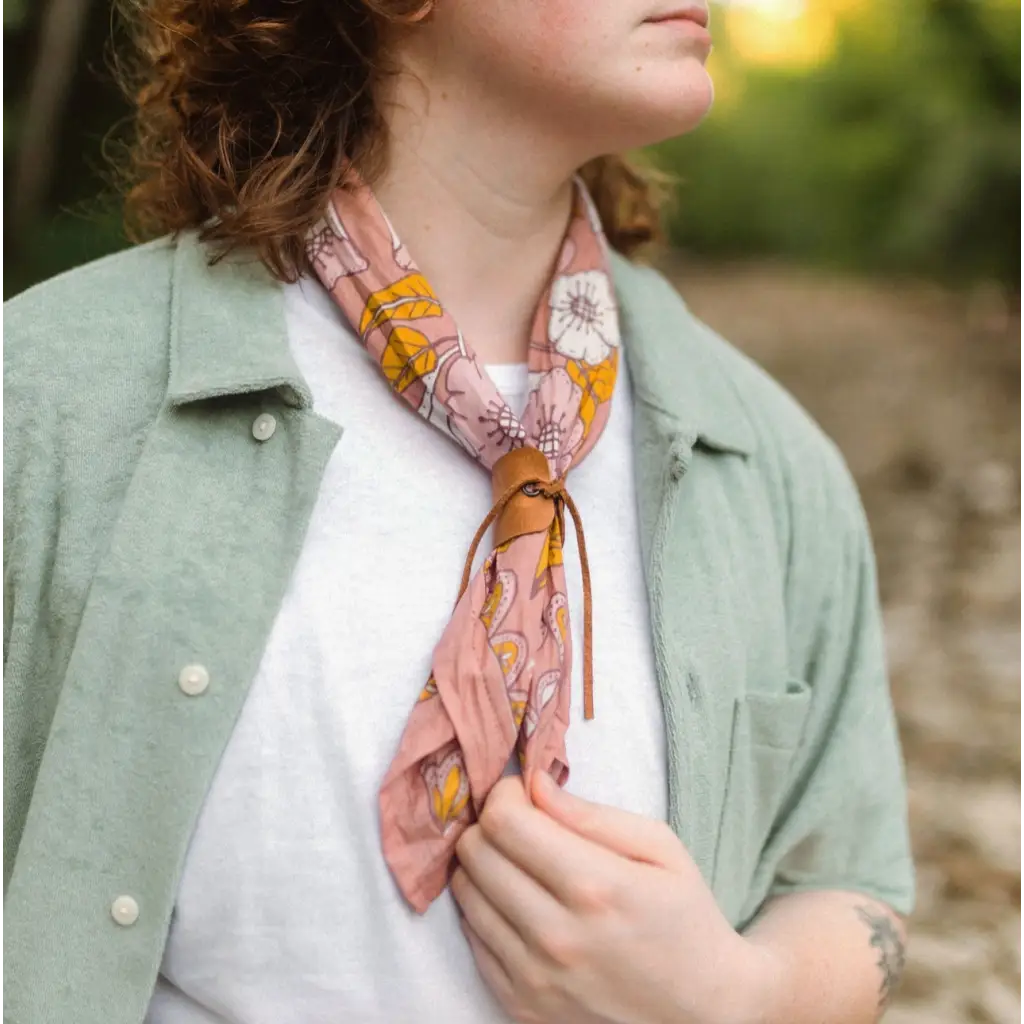 Stylish Evangeline Silk Scarf with polished prints in pink and orange tied around neck