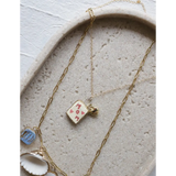 Gold layering necklaces with MOM pendant, heart, seashell, and blue clay charms