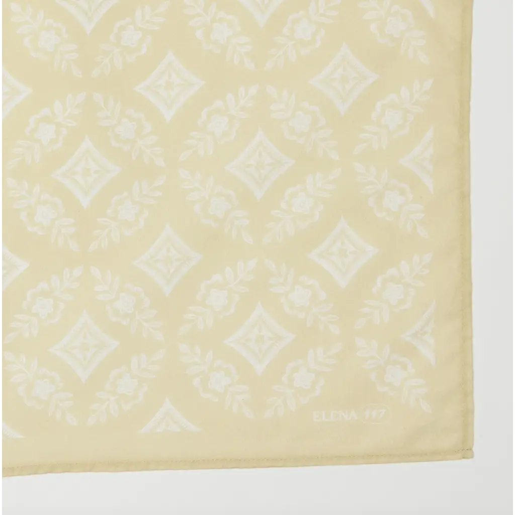 Cream-colored bandana with diamond pattern, perfect for stylish womens clothes