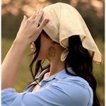 Person in light blue shirt and cream head covering showcasing Elena Bandana with Polished Prints