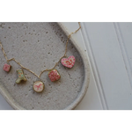 Gold chain necklace with colorful clay seaside charms on Pretty in Pink product page