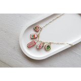Gold chain necklace with five embroidered clay seaside charms from No 7 Its Working Out