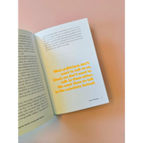 Open book displaying yellow text from Greta Thunberg’s speeches made in polished prints