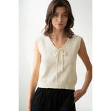 Woman in cream knit vest from Olivia V-Neck Knit Vest with Neck Strap, stylish womens clothes
