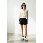 Woman wearing Olivia V-Neck Knit Vest with Neck Strap, stylish womens clothes look