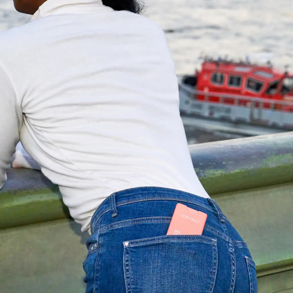 Blue denim jeans with white stitching and pockets